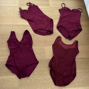 Four used burgundy leotards. One is Yumiko and the rest are Capezio.